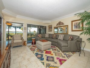 Living Room with Deck Access and Water Views at 1848 Beachside Tennis