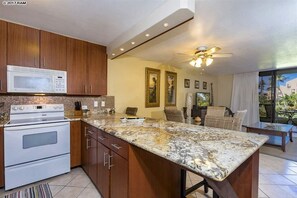 remodeled kitchen with granite countertops