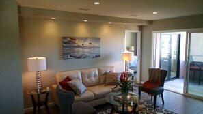 living room with sliding doors to balcony