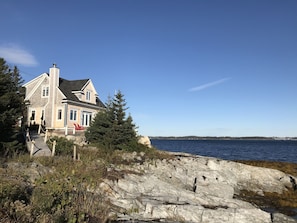 Our beach house is perched on the edge of the Atlantic ocean & Lunenburg Harbor.