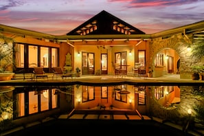 CASA ANTIGUA FROM THE INFINITY EDGE POOL AT NIGHT 