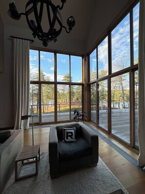 View from the living room to wrap-around deck.