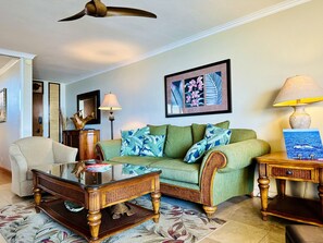 The living room is furnished with Tommy Bahama furnishings