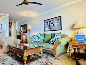 The living room is furnished with Tommy Bahama furnishings