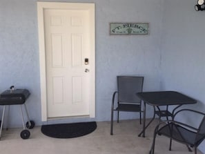 Carport with bistro and grill area.