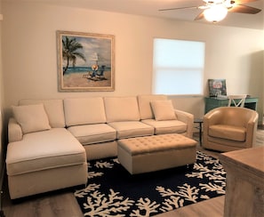 Family Room features oversized sofa, for lots of relaxation.