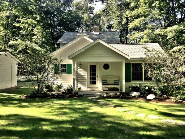 View of home from the backyard w/welcoming landscaping.