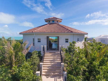 Enter the prestigious penthouse through its grand front entrance, exuding an air of sophistication and elegance
