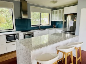 Kitchen with dishwasher and large fridge