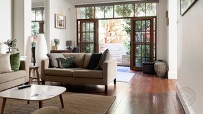 The main living room looking out to the deck and garden.