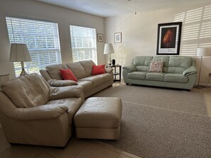 Sunny, spacious living room with pull out queen sofa