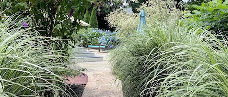 Walkway to backyard and outdoor shower