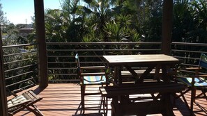 Private deck surrounded by tropical garden.