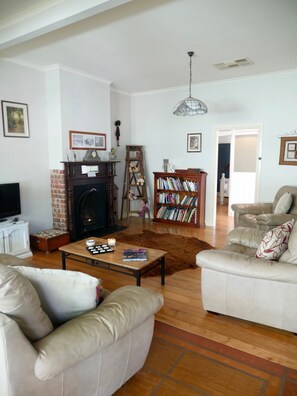 Cosy lounge room with books, music, movies, and games.