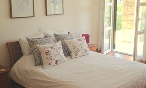 Main bedroom with access to lower terrace and garden