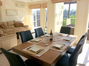 The dining table with room for up to eight people (two extra chairs provided).