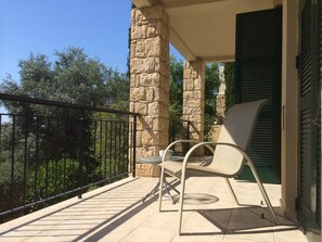 Relax on the lower terrace which also has steps down to the garden.