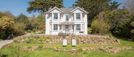 The house surrounded by gardens