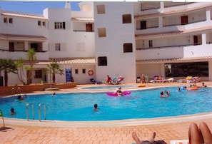 Children's pool and large pool with sunbeds