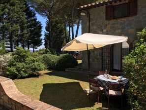 private garden with dining table and chairs