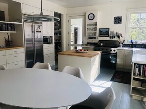 Kitchen and dining area with lots of natural light and anything you'd need