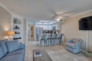 The entertainment console with large Smart TV & DVD plus adjacent seating for 2.