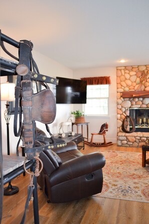 Living space with antique draft horse driving bridle from the early 1900's.