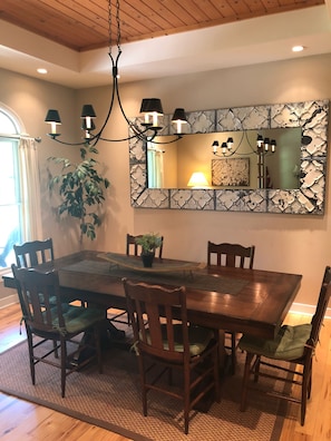 Gather the family for food in this dining room, kitchen area or screened porch