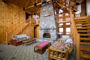 Living room with stone fireplace