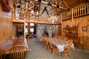 Dining room with stone fireplace