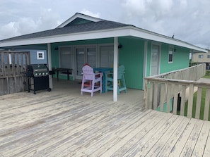 Back of house has lots of deck space and a large yard