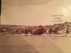 Vintage image of cottage from water 