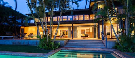 evening glow of the pool and home