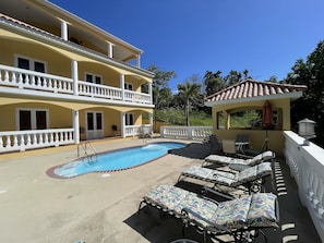 Tres Soles poolside apartment is located on the lower level, opens to pool deck