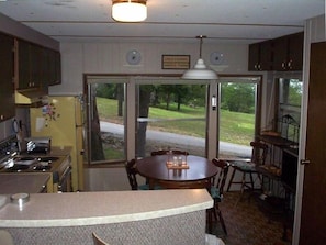 Kitchen and bay window - covered porch/deck is to the right.