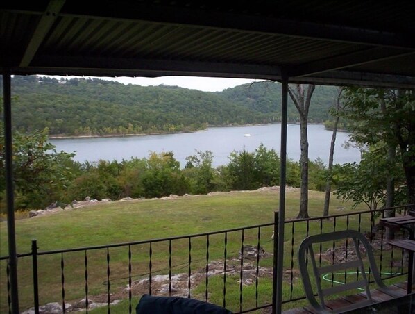 Lake front view from covered deck, road to shoreline (less 1/8 mi)is to the left