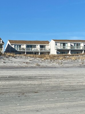 End condo on left, steps to the sand and ocean. 