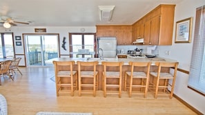 View from living room through kitchen over island to Bogue Sound