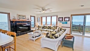 View from kitchen south through living room to deck to Atlantic
