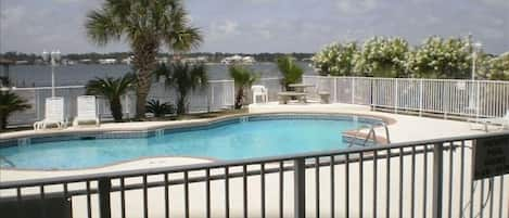 Pool area with pier, gazebo and barbecue grill area