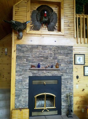 Wood burning fireplace in great room.