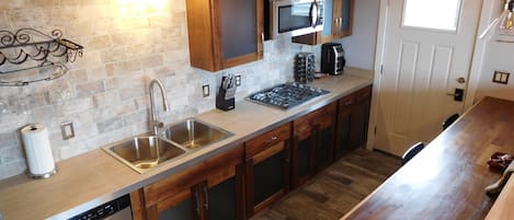 Kitchen with walnut and powder-coated aluminum cabinets