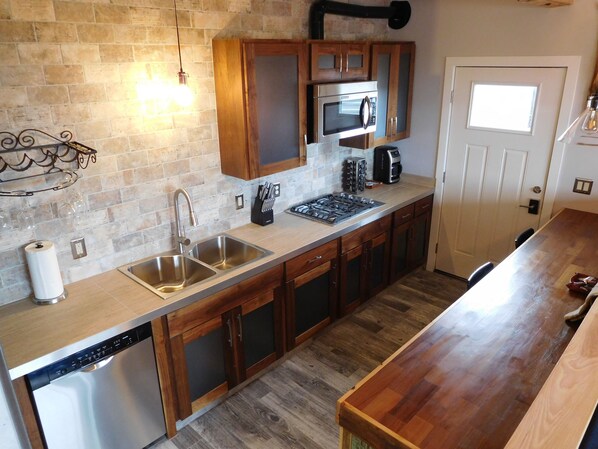 Kitchen with walnut and powder-coated aluminum cabinets