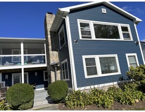 Back of the home with new blue stone paver porch