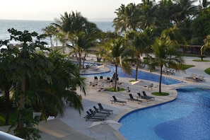 A Beautiful View Across the Pool to the Beach - actual view from our balcony