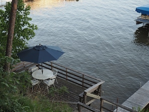 Fantastic lake side deck with eating area and umbrella to keep you shaded.