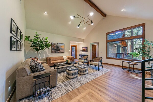 Newly added family room with vaulted ceiling and view to backyard