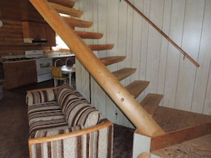 Open staircase, leads to 2 bedrooms and a half bath upstairs 