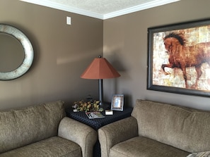 Living Room with 2 fold out twin beds and large screen TV