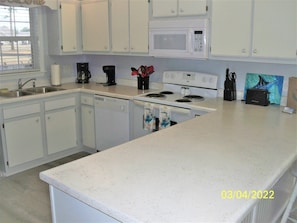 Kitchen with refinished countertop.